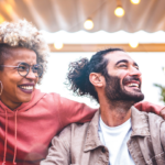 a group of people in a semi circle, smiling